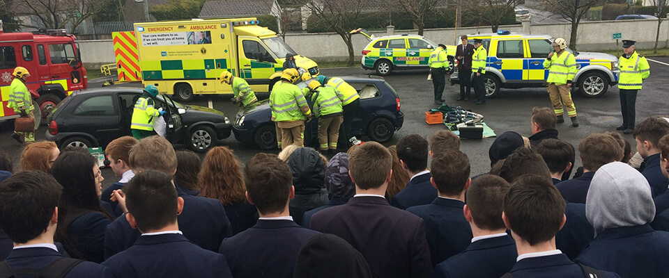 Students watching accident recreation during PSNI Roadsafe Roadshow